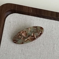 Oval acetate hair clip with olive green and cream marble pattern in a vintage style - Coffee Green