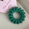 Forest green knitted spiral hair tie with soft woven texture on a beige tray - Candy Color Telephone Cord-Deep Green