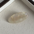Detail view of oval champagne acetate hair clip with FRANCE Handmade engraving - Mermaid Color