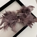 Close-up of fluffy ostrich feathers on a premium dusty rose hair claw clip - Heavy Ostrich Feather Claw Clip - Coffee