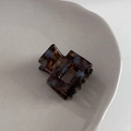 Detail of square acetate hair claw with brown tortoise pattern and gold handmade logo - Blue Brown