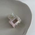 Detail of a handmade mini square acetate hair claw with pearlescent pink gradient - Mermaid Gray