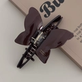Detailed view of handmade dark brown butterfly hair claw with glossy finish and metal spring - Dark Coffee