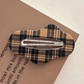 Close-up of wavy yellow and black plaid fabric hair clip on a textured card - Cloud-Light Coffee Plaid