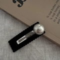 Detail of black flocked shark clip with large silver sphere on vintage book background - Square Snap Clip / Black With Champagne Pearl