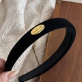 Close-up of black velvet headband with a golden handmade metal buckle detail - Black Velvet Oval Gold Buckle - Narrow Version