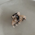 Close-up of acetate amber hair clip with sparkling rhinestones and France logo - Starry Sky Light Tortoise