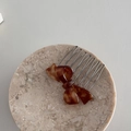 Acetate bow hair comb with tortoiseshell pattern on marble tray for side hair styling - Amber