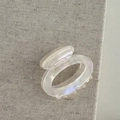 Detail of cream acetate hair claw clip showing the FRANCE Handmade gold engraving - Hollow Small Oval - Mermaid White