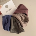 Close-up of high-elasticity fabric scrunchies in navy, brown, dark green, and burgundy - Morandi Color