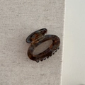 Detail of tortoise shell acetate hair claw clip with France Handmade text on linen - Hollow Small Oval - Blue Coffee