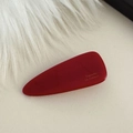 Close-up of deep red acetate triangle hair clip with Barrette la France engraving - Red