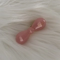 Close-up of pink acetate bow hair clip with gold Barrette a France lettering detail - Light Pink