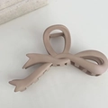 Vista superior de una pinza de pelo con lazo rosa empolvado mate para cabello largo - Albaricoque