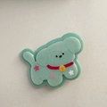 Close-up of mint green cartoon puppy hair clip with stars and soft velvet texture - Green Dog