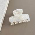 Detail of a vintage marble white hair claw clip with golden Barrette La France lettering - Mermaid White
