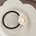 Detailed macro of cream white camellia hair tie with high-elastic dark brown woven rope - Mermaid White