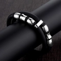 Men's double-layered black leather bracelet with polished silver beads on a wooden background - Polished Metal Cylinder Decor Style (A-38)