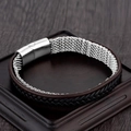 Men's braided leather bracelet with silver magnetic buckle on dark wood background - Brown Black Leather Metal Mesh Style (A-27)