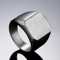 Macro view of minimalist square signet ring showing matte brushed titanium steel texture - US 7 / Steel