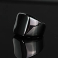 Macro shot of polished black square signet ring with high gloss mirror reflection - US 7 / Black