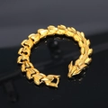 Men's bold golden stainless steel dragon bone bracelet with polished link texture - Gold