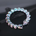 Detailed macro shot of iridescent dragon scale steel bracelet with ornate beast head clasp - Rainbow