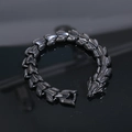 Detail of black titanium steel dragon scale bracelet featuring a bold dragon head clasp - Black