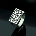 Vintage stainless steel ring with GOOD LUCK engraving and stars on black reflective background - US 7 / Steel