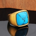 Macro view of square turquoise stone set in a matte gold textured stainless steel ring - Gold Turquoise