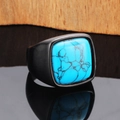 Macro shot of men's black textured ring featuring square blue turquoise stone inlay - Black Color Turquoise