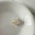 Detailed macro view of pearlescent star hair claw clip with crystal rhinestones - Star-White