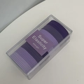 Detail view of purple gradient hair ties with high elasticity in a clear storage box - Gradient Purple