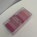 Close-up of pink gradient elastic hair ties in a clear box with Super Elasticity label - Gradient Pink