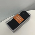 Macro shot of black high elasticity hair ties set in a clear rectangular storage box - Solid Black