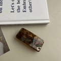 Detailed close-up of a rectangular tortoiseshell hair clip with France Handmade gold lettering - Spring Hair Clip / Blue Brown