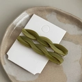 Detail of olive green twisted resin hair clips with silver duckbill metal base on a card - Green