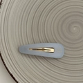 Detail of light blue matte BB hair clip with gold metal spring and handmade engraving - Light Blue