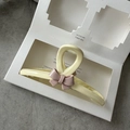 Close-up of cream resin hair claw clip with pink 3D bow and non-slip teeth detail - Ribbon Bow - Cream White