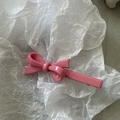 Detailed macro view of a pink bow hair clip with a glittery pearlescent resin finish - Deep Pink Straight Knot