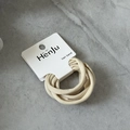 Detailed close-up of high-elasticity hair bands in beige on a white display card - Beige