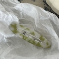 Detail shot of a green and white marble acetate BB hair clip with silver metal base - White Green