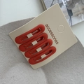 Set of four matte dark red hollow oval metal BB hair clips on accessory card - Orange Red