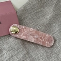 Detailed macro of pink marble acetate hair clip with gold believe in yourself metal disc - Oval Gold Button BB-Pink