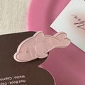 Close-up of pink glitter dolphin hair clip with a jelly texture on a card - Pink Border Dolphin