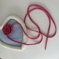 Close-up of heart-shaped denim crossbody bag with plush trim and pink rose decoration - Pink Floral Ribbon Hair Tie