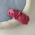 Detailed view of pink satin scrunchie showing glossy silk texture and pleated design - Ruffled Pink BB Clip