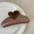 Detail showing the heart-shaped contrast design and smooth finish of the coffee hair claw - Heart-shaped Color-blocked Fan - Brown