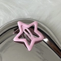 Close-up of pink star-shaped BB hair clip with matte finish on silver metallic tray - Light Pink
