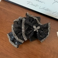 Detail of black mesh hair claw with sparkling sequins and silver rhinestone butterfly - 11cm / Black